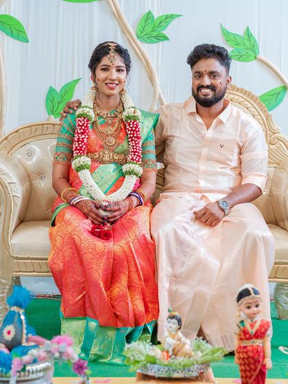A beautiful portrait of the happy couple at their Valaikaapu ceremony. My decorated platters in the foreground add a touch of tradition and artistry to their special moment.