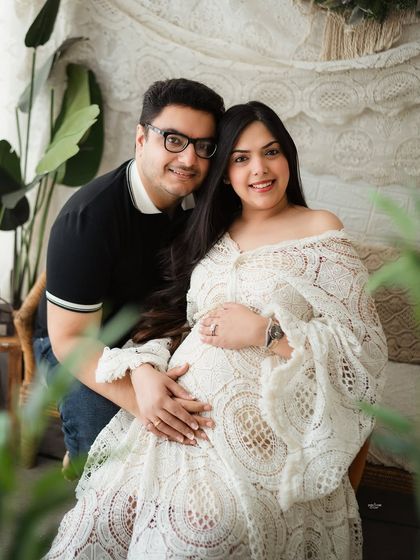 A happy couple enjoying their session in our boho corner. Her lace dress is absolutely beautiful.