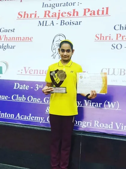 Aditi Yadav proudly displaying her runner-up trophy and certificate from the State Mini Championship.