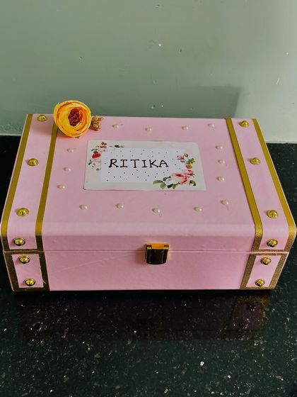 A personalized pink trunk for a bridesmaid named Ritika. I love creating these custom boxes that your friends can cherish long after the wedding day.