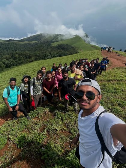 A trek lead takes a selfie with the entire group lined up on the Bandaje trail.