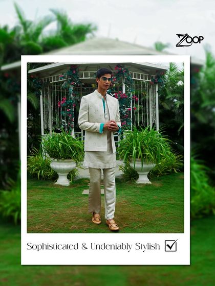 Sophisticated and undeniably stylish, this off-white Jodhpuri set from the Jazbaat Collection is perfect for a garden wedding or a daytime festive event, offering a look of modern royalty.