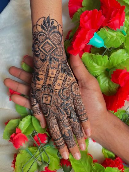 A beautiful couple shot showing off the personalized henna.