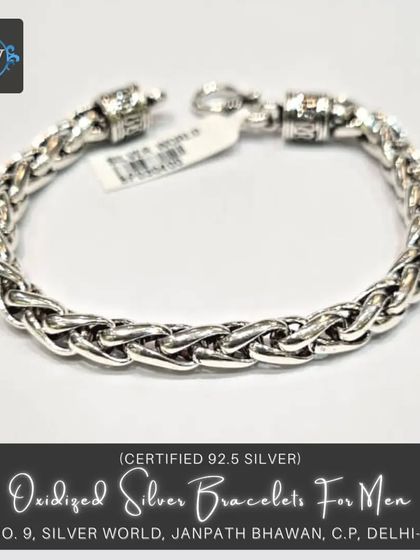 This oxidized silver link bracelet provides a more rugged, vintage aesthetic. The darker finish brings out the detail in the woven links, perfect for a casual, masculine look.