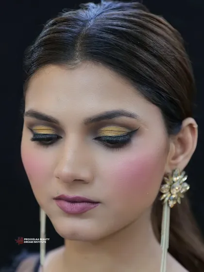 Turned up the glam with this ultimate party look. A dramatic gold and black smokey eye makes a bold statement, perfect for dancing the night away.