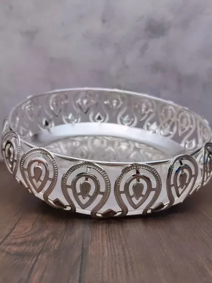 Another angle of the leaf designer tray, showing how the light catches the intricate cuts in the border.