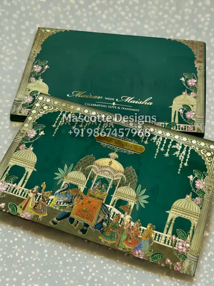We bring royal celebrations to life with our hardback Pichwai-themed wedding invites. This design features a detailed illustration of a traditional wedding procession, complete with elephants and intricate architectural motifs. The rich emerald green and gold foil detailing make this a true keepsake for a grand Indian wedding.