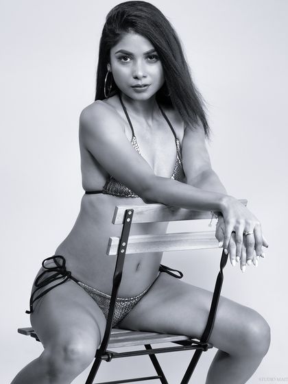 A black and white edit of the bikini shot, creating a high-fashion, high-contrast look that emphasizes the model's pose and form.