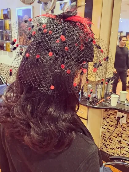 Another angle of the fascinator look. I can work with any accessory you have in mind to create a cohesive and stunning hairstyle for your event.