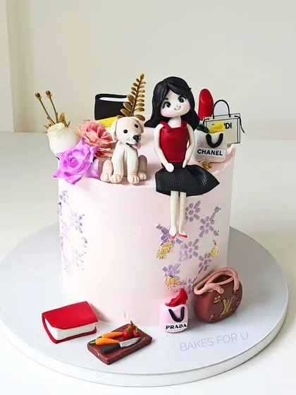 A personalized birthday cake celebrating all of someone's favorite things: fashion, dogs, books, and chopping vegetables. This cake is a great example of how I can tell a personal story through edible art.
