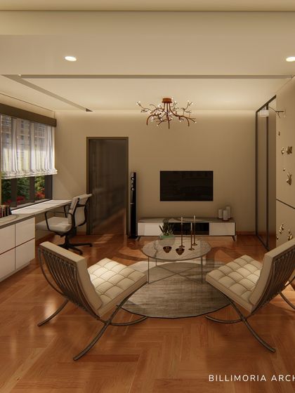 This spacious bedroom combines a sleeping area with a comfortable lounge and a dedicated workspace. The neutral color palette and warm wooden flooring create a cohesive and relaxing environment.