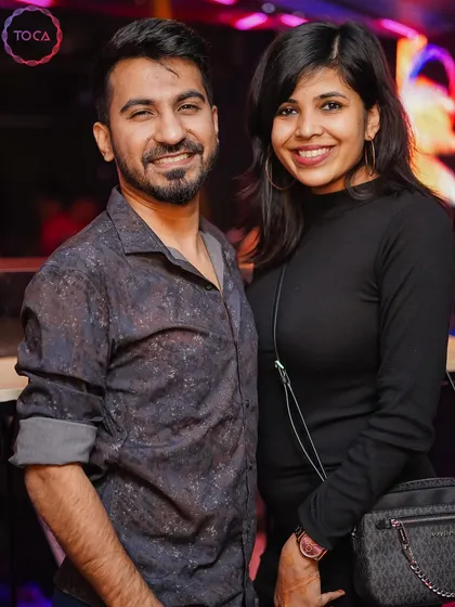 A couple posing for a photo.