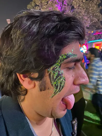 A green and black glitter design for this fun-loving client. His expression says it all!