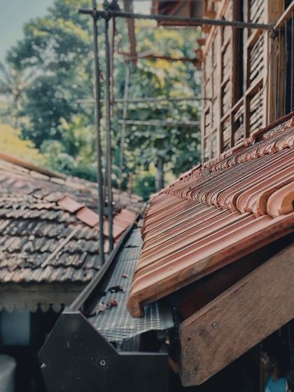 A close-up of the tiled roof and gutter system, a practical detail that is essential for managing heavy monsoon rains in Goa.