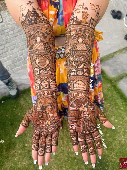 A tale of two cities, New York and Mumbai. This bridal mehendi features the Statue of Liberty and the Gateway of India, along with traditional wedding scenes like the vidaai ceremony.