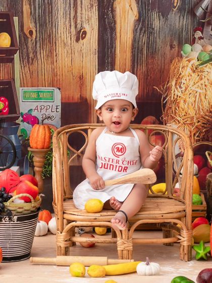 A Masterchef Junior in his farm-fresh kitchen. This theme is full of character and results in wonderfully playful and unique photos.