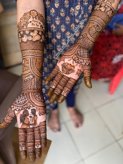 A sweet baby shower mehendi with a couple portrait and other baby-themed elements. It's a beautiful way to celebrate the parents-to-be.