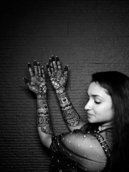 Another beautiful profile shot in black and white, highlighting the elegance of the bride and her mehendi.