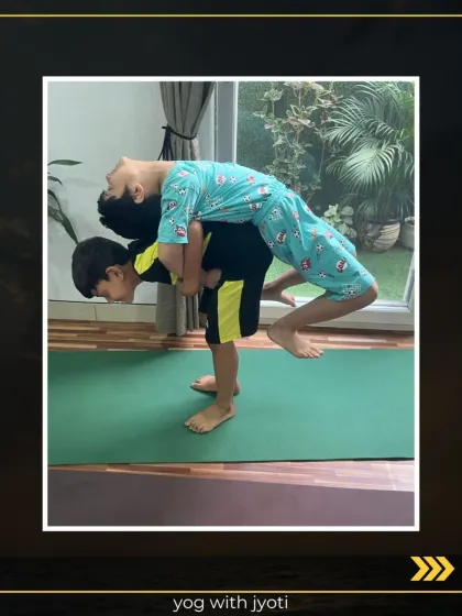 Two young boys working together in a partner backbend. This activity fosters teamwork and helps them develop physical confidence.