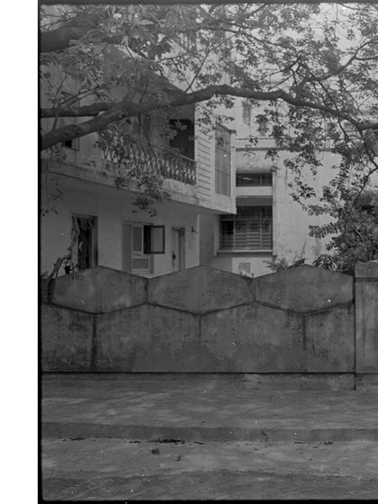 A black and white film photograph of a house in our neighborhood. It's the season of analog at the studio, and we love sharing the magic of shooting and developing film.
