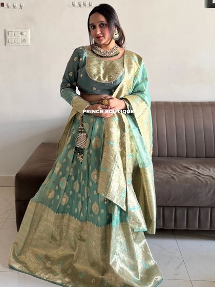 A duplicate of 235, a full view of the elegant Banarasi lehenga.