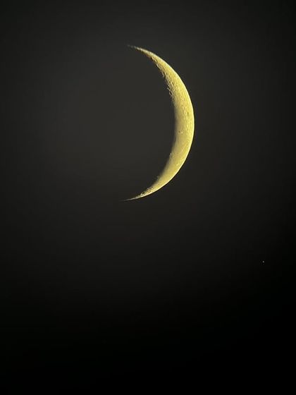 A stunning image of the crescent moon, captured through a telescope during our sky-gazing event. This is the kind of awe-inspiring moment that fuels a child's imagination and their desire to understand the universe.