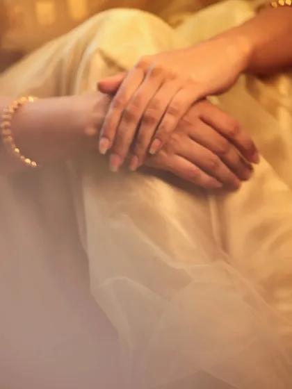 A simple, artistic shot focusing on the bride's hands. It's a quiet, contemplative image that adds a different pace to the gallery.