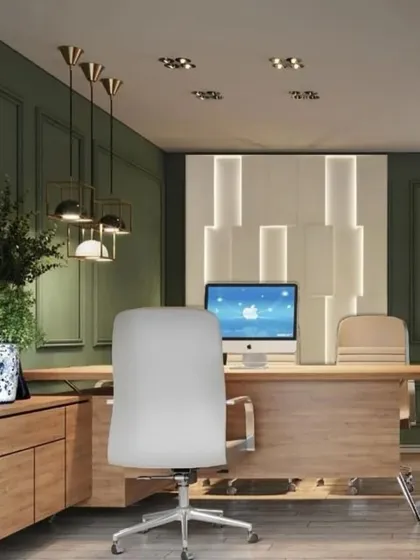 The executive workstation in a modern office, combining natural wood tones with a rich green accent wall. The design is clean and uncluttered, with stylish pendant lighting and a backlit feature wall adding a touch of sophistication.