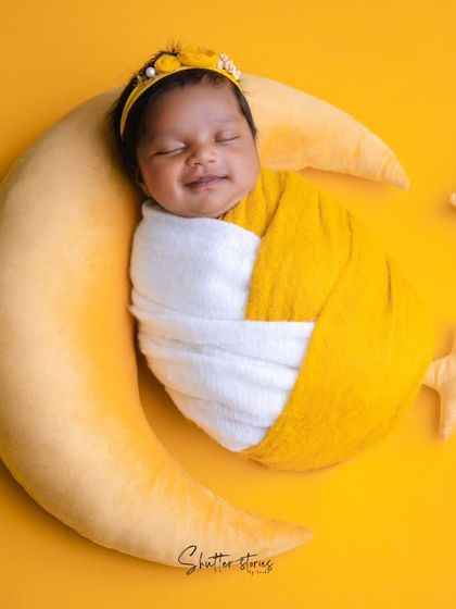 A happy, sleepy smile from our little star on the moon, a perfect shot to end this sweet series.