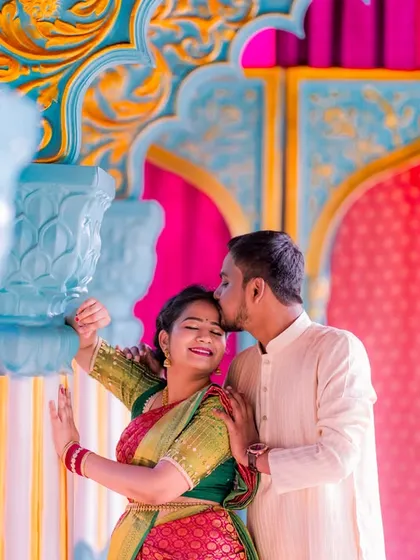 A tender moment in our colorful Jaipuri palace set, perfect for capturing the romance of a traditional photoshoot.
