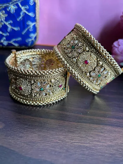 A styled shot of the broad bridal 'kadas'.