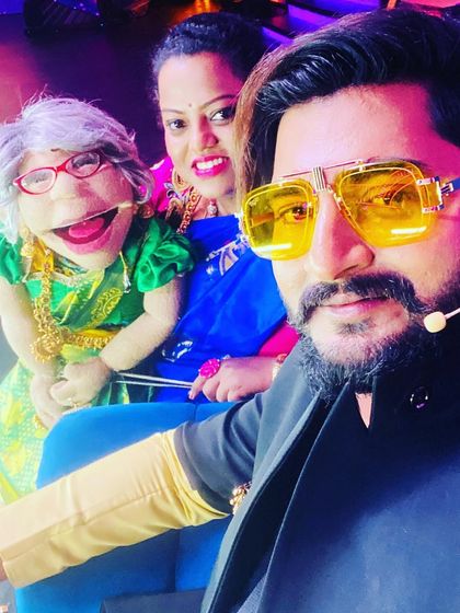 Another great moment on the Gichi Gili Gili set with a fellow artist. The colorful background and energy are a huge part of the show's appeal.