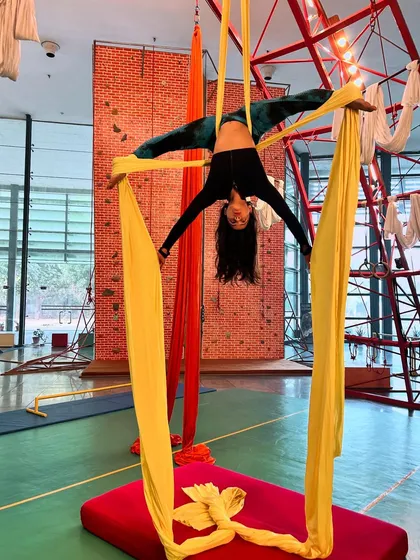 Master the art of aerial silks with us. This beautiful inverted split showcases the combination of strength, flexibility, and control you will develop in our aerial silks program.