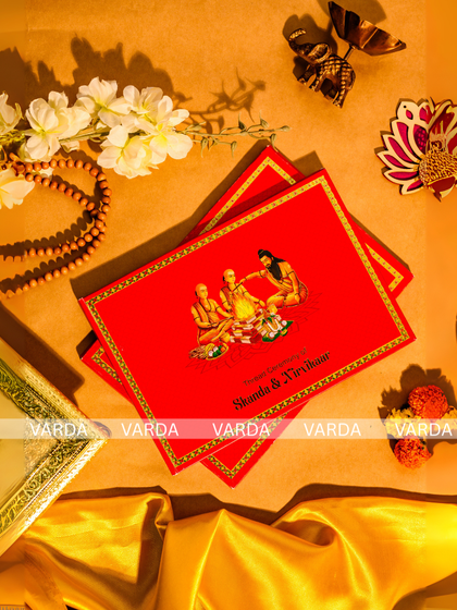 A bold and traditional invitation for a thread ceremony, featuring a vibrant red card with an illustration of the Upanayana ritual. This design is perfect for families wanting to highlight the sacred and customary aspects of the event.