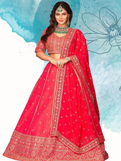 This vibrant red lehenga with gold embroidery is designed to give you your celebrity moment. It's a classic, glamorous choice for any bride.