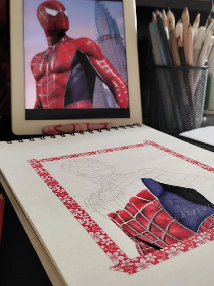 My workspace view of the Spider-Man WIP, with the reference image on my tablet.