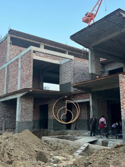 From blueprints to bricks. This image captures the raw beauty of a project under construction, with the foundational structure and brickwork rising from the ground, showing the very first steps of a vision coming to life.