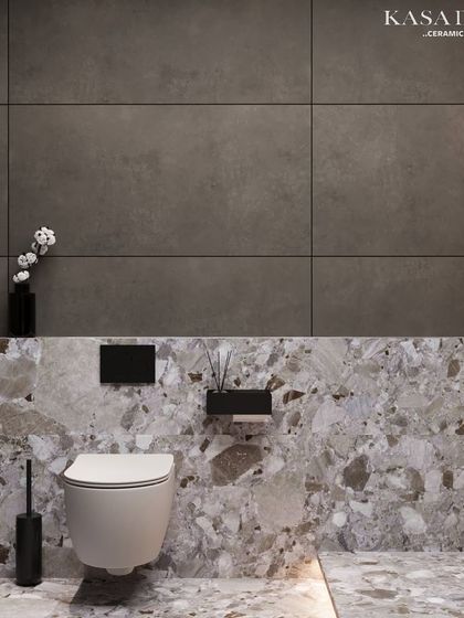 Here, I've combined two distinct tile styles to create a balanced and modern look. The lower wall and floor feature a striking terrazzo pattern, providing a robust and decorative base. Above, large-format, dark grey concrete-effect tiles offer a clean, minimalist contrast, making the space feel both grounded and expansive.