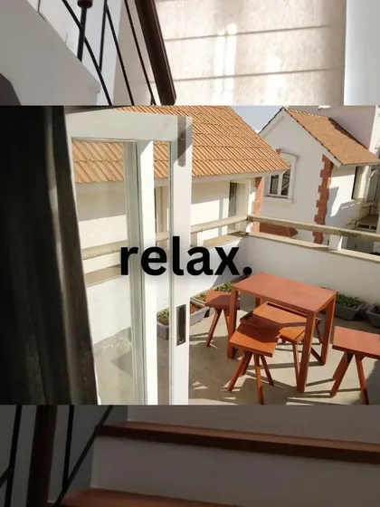 Even a small outdoor space can become a peaceful retreat. Here, a simple wooden table set on a compact patio provides a quiet corner to enjoy the outdoors.