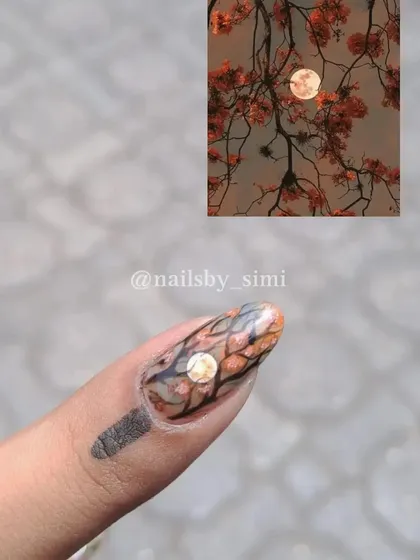 A tiny piece of art on a nail. This design was inspired by a beautiful picture of a full moon seen through blooming tree branches.