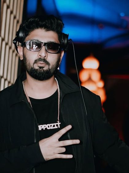 Peace from the DJ booth. A quick pose during a packed Saturday night at Badmaash.