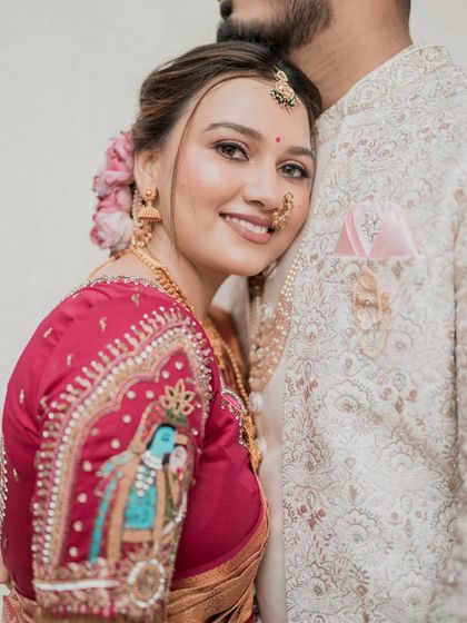 A close-up of the bride's happy face, showcasing the soft and romantic makeup.