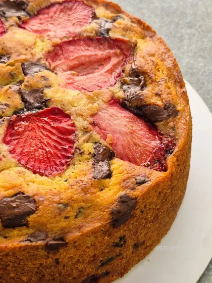 The rustic, golden-brown crust of the strawberry vanilla tea-time cake. It's a simple, comforting cake that's perfect with a cup of tea or coffee.