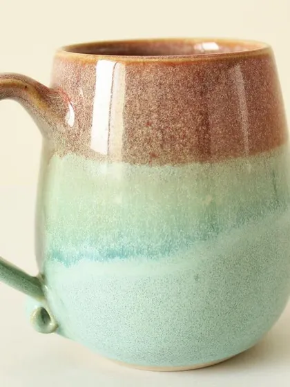 My Pist-a-chio mug features a beautiful, flowing blend of blushing rouge and soft green glazes. The colors melt into each other, creating a dreamy, watercolor-like effect.