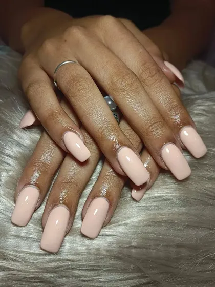 It’s the season of nude nails. This client is loving a soft, peachy-nude vibe for summer on these long, square-shaped extensions.