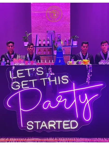 This bar setup says it all. With a bold neon sign and our professional team ready to serve, we were all set to get the party started.