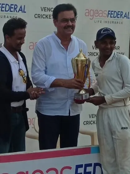 Jay Nadar receiving the Best Batsman award from cricket legend Dilip Vengsarkar.