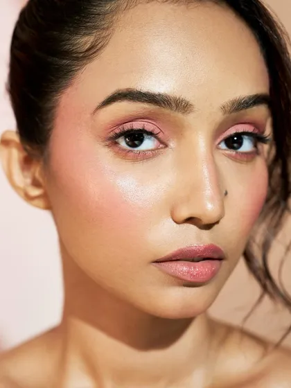 A close-up on the soft pink monochromatic look. The seamless blending of the blush and eyeshadow creates a sophisticated and modern beauty statement.