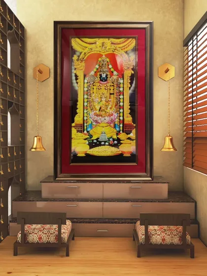 A grand Tanjore painting of Lord Venkateswara becomes the centerpiece of a dedicated prayer room, its antique gold frame enhancing the divine atmosphere.