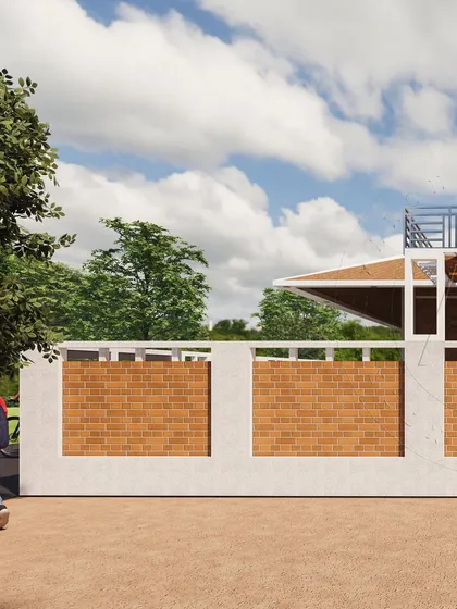 A close-up of a compound wall design that uses panels of exposed clay brick. This detail highlights our commitment to vernacular architecture, using local materials to create texture, warmth, and a connection to heritage.